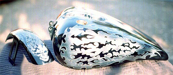 skull and tribal graphics on motorcycle parts