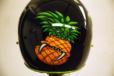 Pineapple character airbrushed on helmet