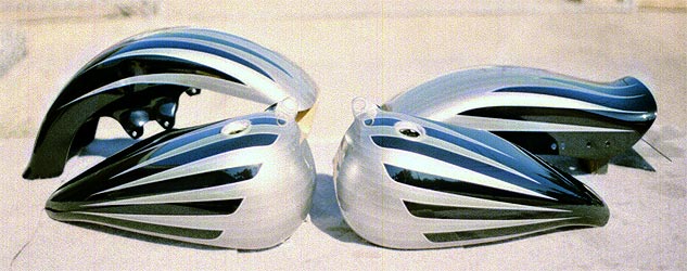 silver scallops on black motorcycle parts