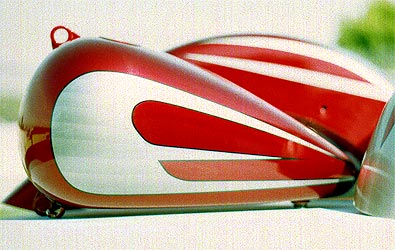 silver scallops on candy red Harley Davidson motorcycle parts