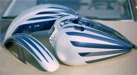 silver scallops on blue motorcycle parts